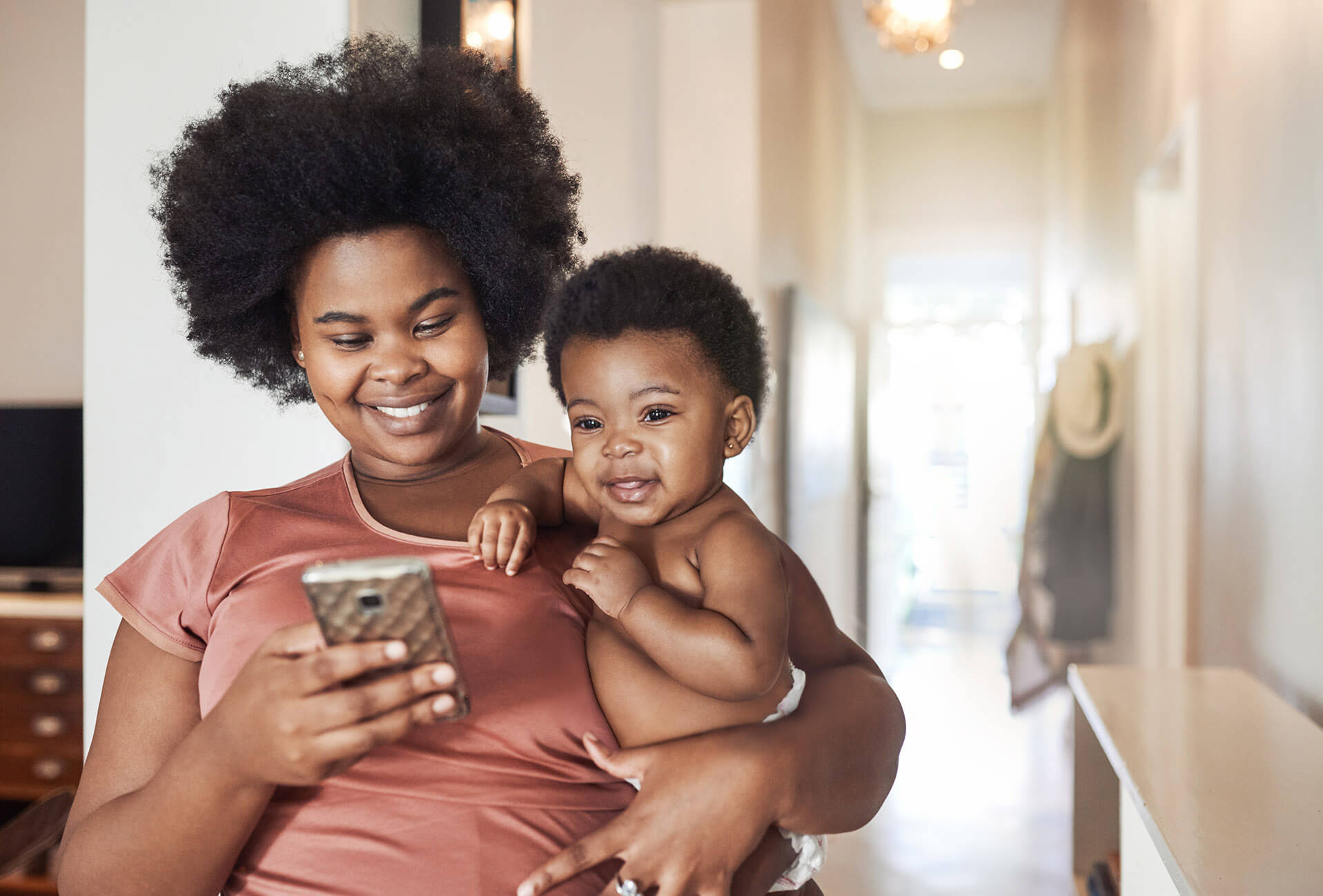 A mother holding baby.