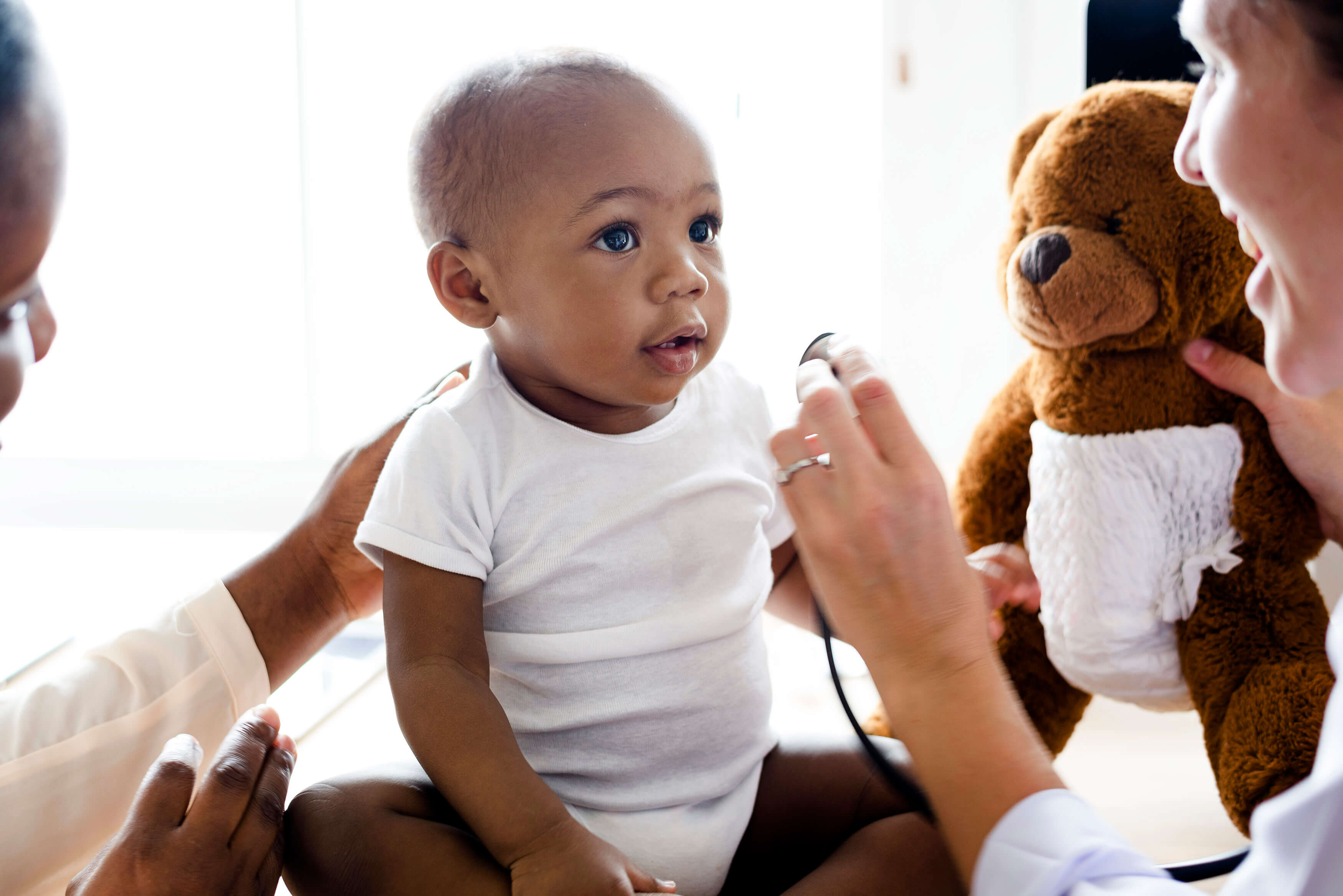 An infant getting a check up at the doctor's office