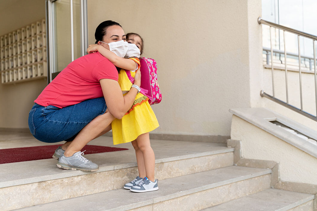 A mother giving her daughter a hug