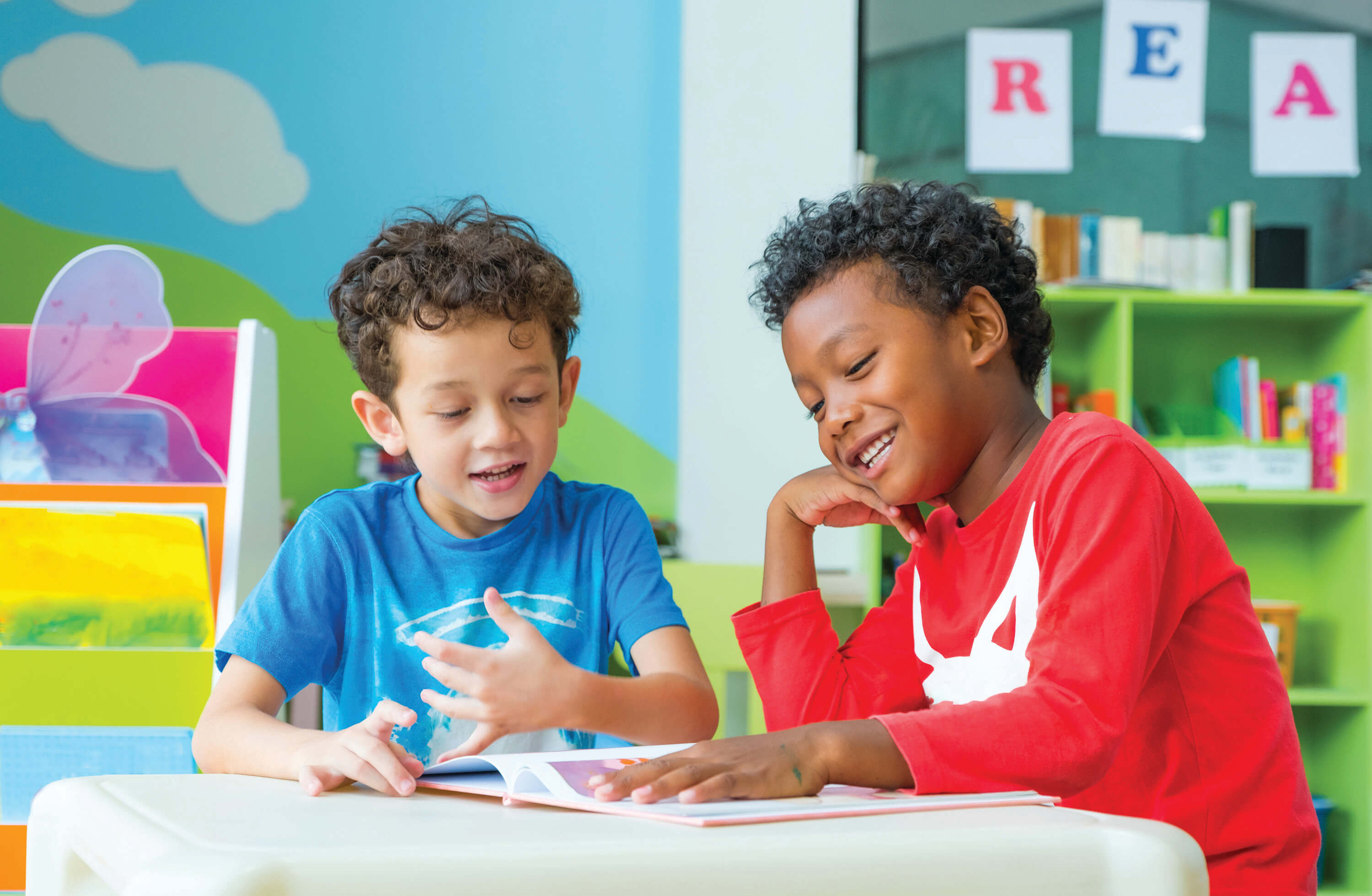 Two male students working at their table