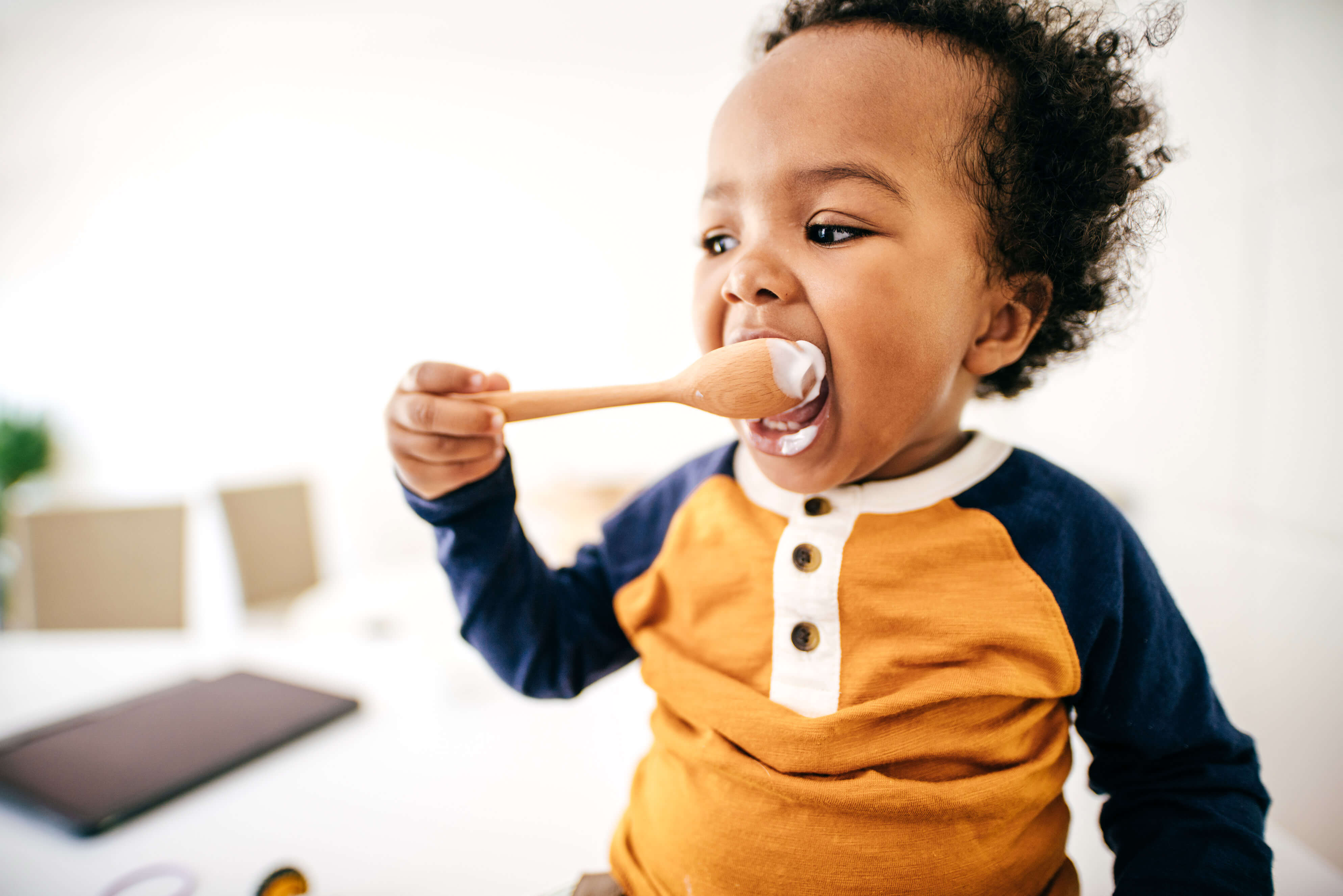 Toddler eating from a spoon