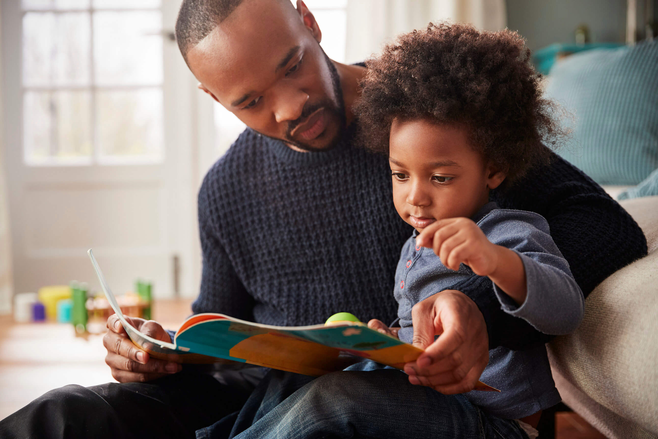 Father reading to his son